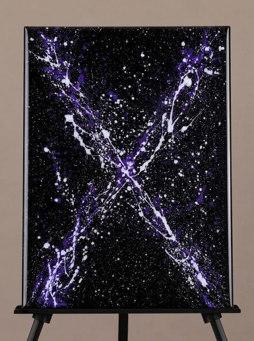 Cosmic purple and white splatter painting on black canvas